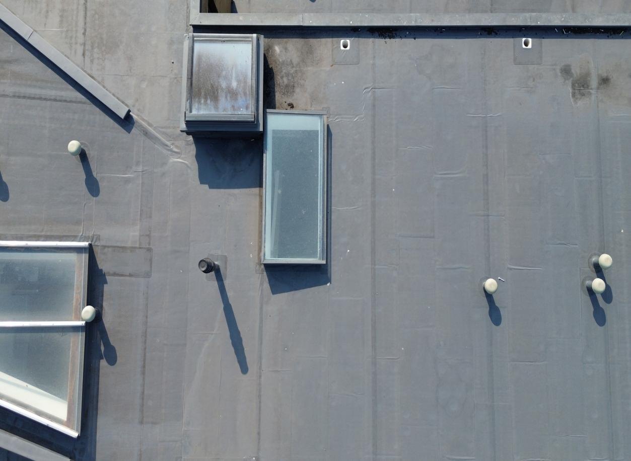 Rooflights, roof covering and service penetrations viewed from above.