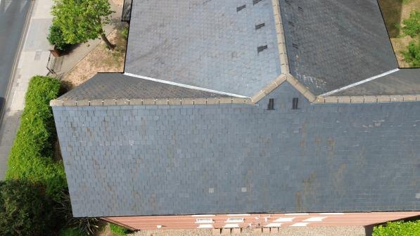 Overhead view of intersecting pitched roof slopes.